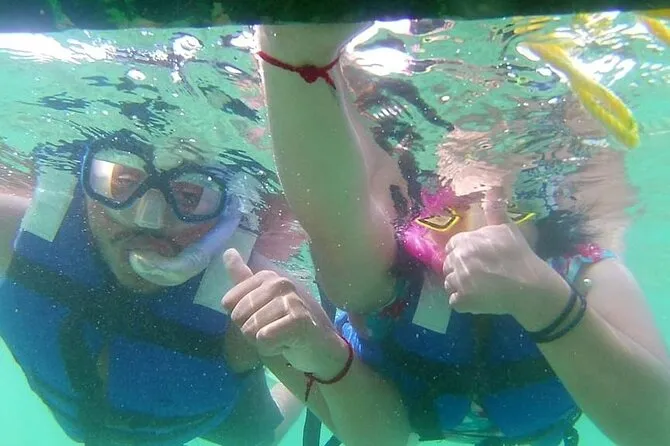 Snorkeler exploring live coral at Coral Beach on Ixtapa Island on a guided snorkeling tour from Zihuatanejo Mexico