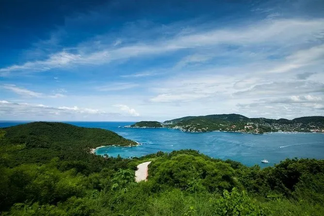 Snorkeler floating above the coral reef at Las Gatas Beach in Zihuatanejo Bay Mexico on a guided snorkeling experience